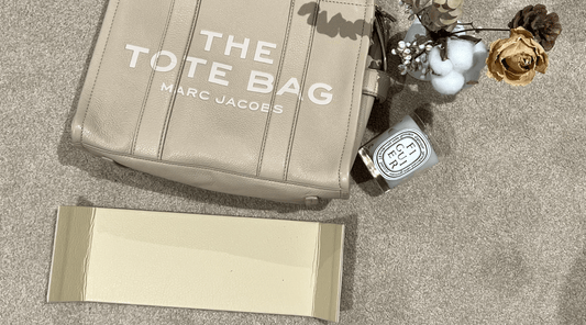 Soft tote bag sagging under the weight of everyday items